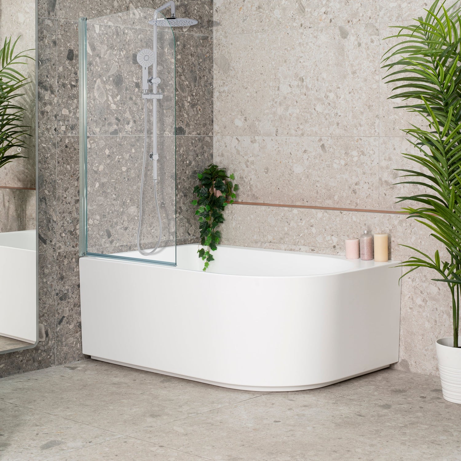 Arco Plus 1400mm corner bath with a matte white finish, featuring a glass shower screen in a modern bathroom.