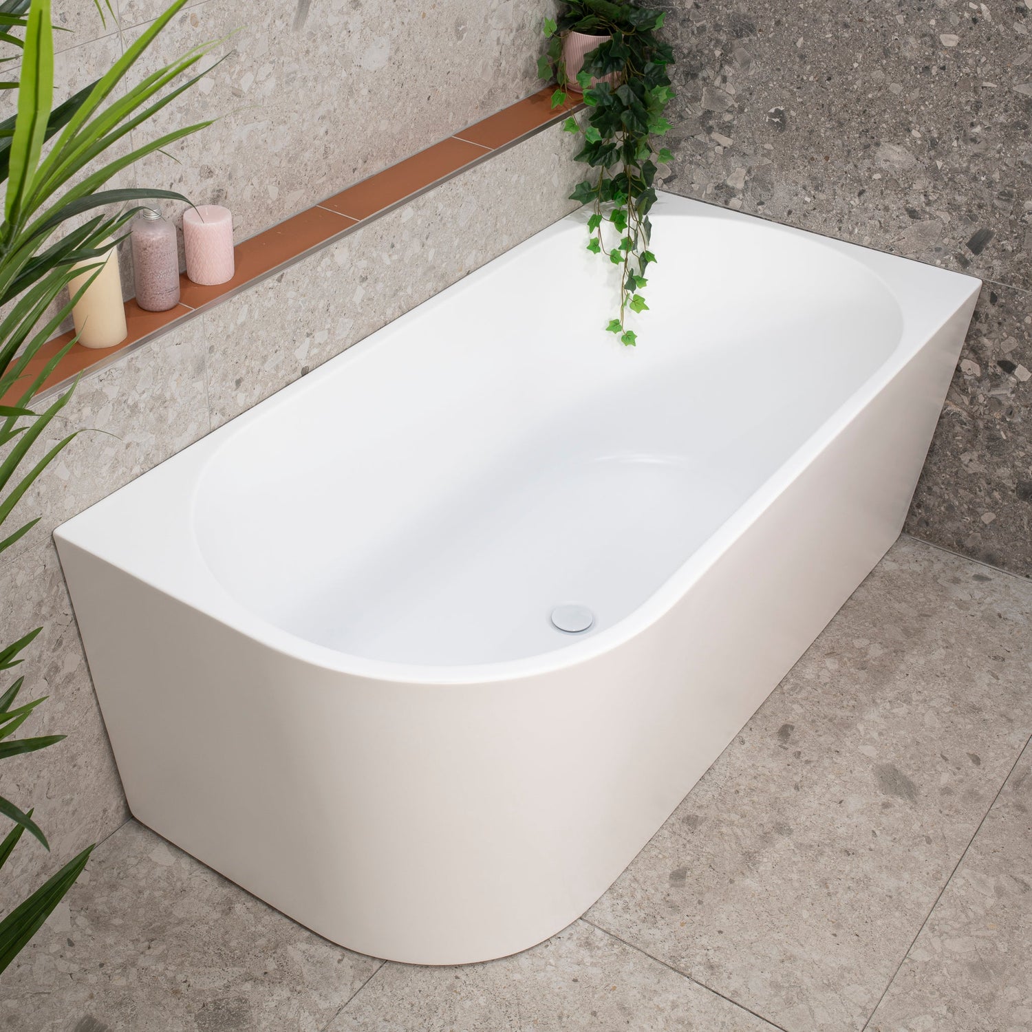 Avalon Corner Freestanding Bath in matte white, designed to fit neatly against two walls.