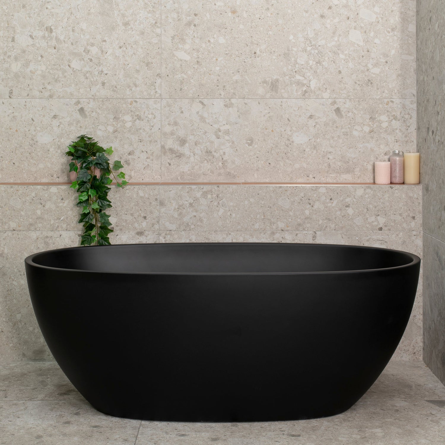 Byron Egg Oval freestanding bath in matte black, set in a modern bathroom.