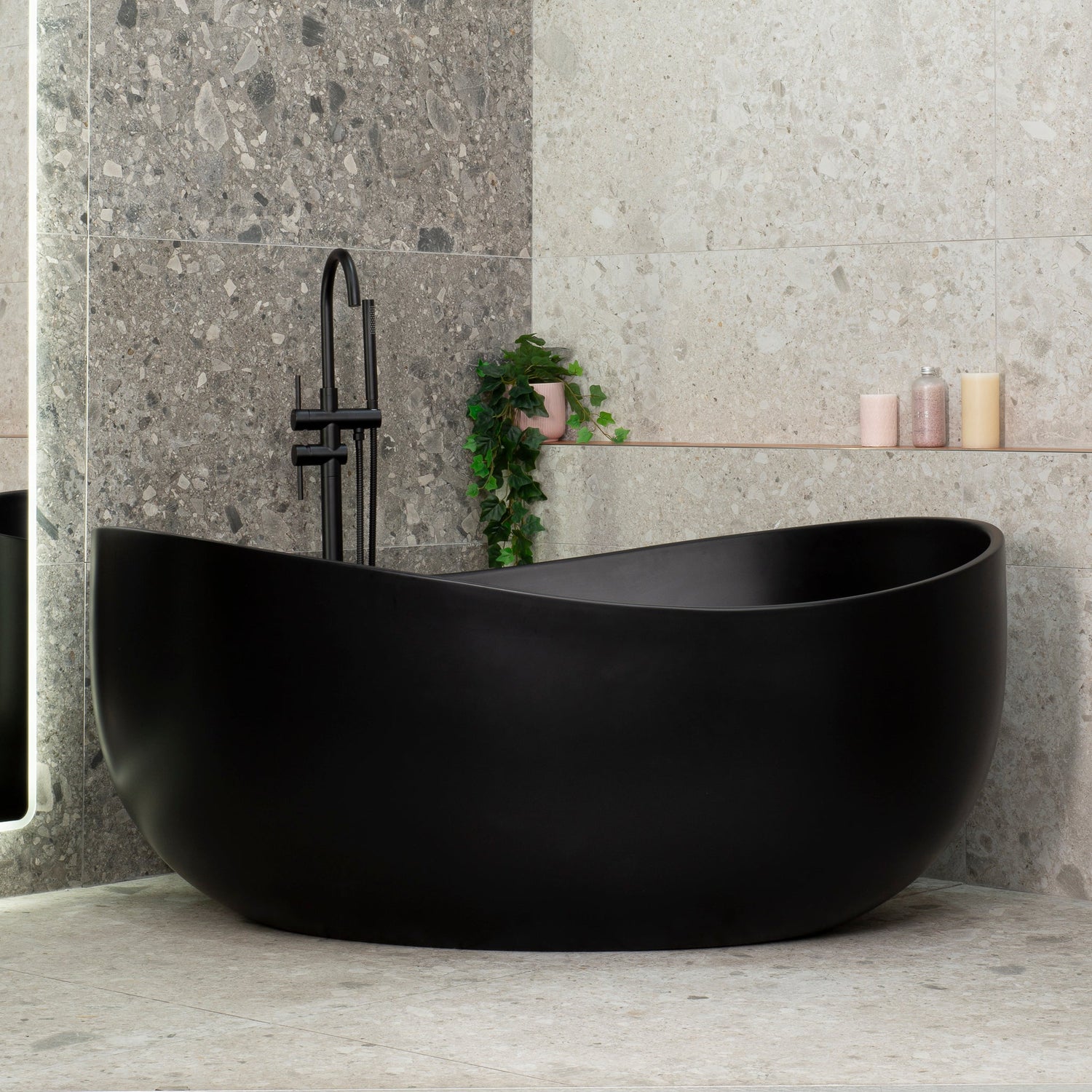 Wave Oval 1600mm wide freestanding bath in matte white, featuring an elegant asymmetrical rim.